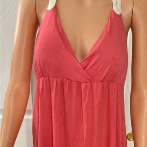 New with tags Pretty pink/coral dress with crocheted racerback detail.